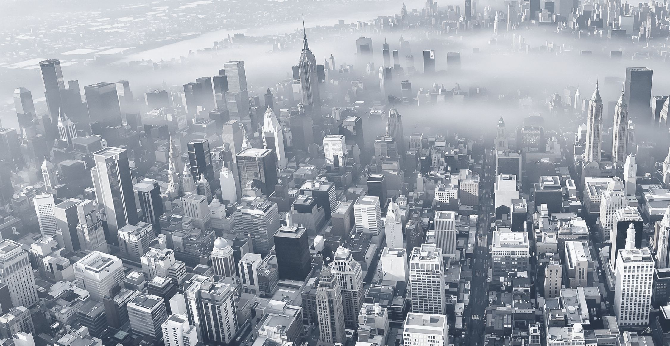 Midtown Manhattan from above, morning fog over the city.